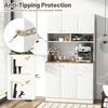 A white kitchen cabinet with a coffee machine and decorative items on display, with an inset showing anti-tipping protection. Produktbild-Vorschau