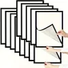 A stack of magnetic photo frames with hands demonstrating how to peel off the backing. Anteprima dell’immagine prodotto