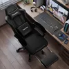 A gaming chair and desk setup with a computer, keyboard, mouse, and headphones. Voir les images du produit