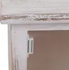 A close-up view of the interior of a white wooden cabinet, showing a magnetic catch mechanism. Produktbild-Vorschau
