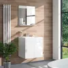 A modern bathroom vanity with a mirror, sink, and faucet, set against a wood-paneled wall with a large window overlooking a garden. Podgląd zdjęcia produktu
