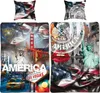 A collage of American-themed imagery, including landmarks, flags, and text, presented as bedding. Produktbild-Vorschau