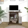 A computer desk with a monitor, keyboard, and storage shelves, set in a room with a plant. Podgląd zdjęcia produktu