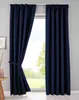 A pair of navy blue curtains are shown tied back on the left side, revealing a window with a view of trees and sky. The curtains are hung from a white rod. Produktbild-Vorschau