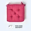 A square seat cushion with tufted details and ties, presented on a white background. Náhled obrázku produktu