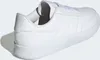A white Adidas sneaker is shown from a side-rear angle against a white background. Voir les images du produit