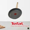 A frying pan with a wooden handle is shown against a white background, with text and a logo below. Náhľad obrázku produktu