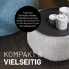 Close-up of two poufs, one blue and one gray, with a black tray and candles on top of the gray pouf. Text overlays describe the product's features. Produktbild-Vorschau
