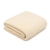 A folded cream-colored blanket is shown against a white background. Produktbild-Vorschau