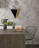 A modern kitchen counter with a pendant light, fruit basket, and books. Produktbild-Vorschau