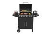 A black gas grill with the lid open, showing food being cooked on the grates and a pot on a side burner. There are also bottles of condiments on a side shelf. Podgląd zdjęcia produktu