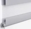 A close-up view of a grey roller blind with horizontal stripes. Produktbild-Vorschau