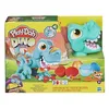 The image shows the packaging of a Play-Doh T-Rex dinosaur toy set. The packaging features colorful illustrations of dinosaurs and the Play-Doh logo. Produktbild-Vorschau