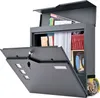 A gray mailbox with its front door open, revealing mail and magazines inside. A newspaper is visible in the lower compartment. Produktbild-Vorschau