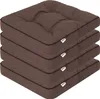 A stack of four brown seat cushions. Anteprima dell’immagine prodotto