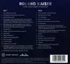 A dark blue background with white text listing song titles for two CDs. Voir les images du produit