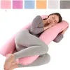 A woman is sleeping on a U-shaped pregnancy pillow. Produktbild-Vorschau