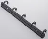 A close-up, angled shot of a black metal binder clip. Voir les images du produit
