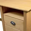 A close-up view of a wooden desk with drawers. Podgląd zdjęcia produktu