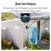 A security camera is shown mounted on a house, with a person entering the frame and being highlighted by a blue box, indicating tracking. Produktbild-Vorschau