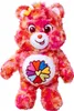 A stuffed toy bear with a colorful tie-dye pattern and a flower symbol on its belly. Anteprima dell’immagine prodotto