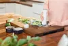 A person is using a vacuum sealer on a cutting board in a kitchen. Náhľad obrázku produktu