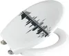 A white toilet seat with a black and gray silhouette of a city skyline printed on the lid. Produktbild-Vorschau