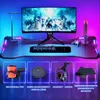 A gaming desk setup with a monitor, keyboard, mouse, and various accessories displayed below. Voir les images du produit
