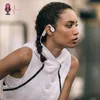A woman with braided hair wearing a white sleeveless hoodie and pink and white headphones, looking to the side. Produktbild-Vorschau