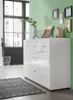 A modern living room with a white sideboard, a patterned rug, and decorative items on top. Produktbild-Vorschau