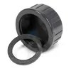 A dark gray threaded cap with a black rubber washer next to it, isolated on a white background. Produktbild-Vorschau
