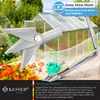 A close-up of a greenhouse window opener with a greenhouse in the background. Produktbild-Vorschau