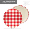 A close-up view of a red and white checkered jar lid. Podgląd zdjęcia produktu