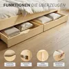 A wooden bed frame with drawers open, showing storage space and details of its construction. Voir les images du produit