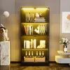 A modern living room with a black glass display cabinet filled with books and decorative items, illuminated by LED lights. Náhled obrázku produktu