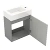 A white ceramic sink is mounted on a gray cabinet with one door open, revealing the interior. Podgląd zdjęcia produktu