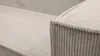 A close-up view of the corner of a couch, showing the texture of the corduroy fabric. Podgląd zdjęcia produktu