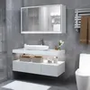 A modern bathroom vanity with a sink, mirror cabinet, and toilet. Podgląd zdjęcia produktu