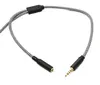 A black and white braided audio cable with a 3.5mm male connector and a 3.5mm female connector. Podgląd zdjęcia produktu