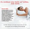 A woman is lying on a bed with a pillow, smiling. Produktbild-Vorschau