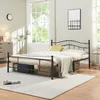 A bedroom scene with a metal bed frame, bedding, and decor. Voir les images du produit
