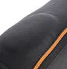 A close-up view of a black fabric product with orange stitching and a padded area. Podgląd zdjęcia produktu