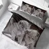 A bedding set with a kitten print is laid out on a bed. Produktbild-Vorschau