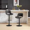 Two black bar stools are placed in front of a kitchen island with a marble countertop. Produktbild-Vorschau