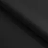 A close-up, angled view of black fabric, likely a bed or mattress, with a fold creating a shadow. Voir les images du produit