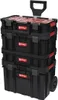 A stack of three black Qbrick toolboxes with red accents and a retractable handle, shown against a white background. Produktbild-Vorschau