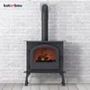 A black wood-burning stove with a lit fire inside, set against a white brick wall and light wooden floor. Produktbild-Vorschau