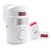A motion sensor alarm system with a remote control and a door/window sensor, displayed against a white background. Voir les images du produit