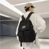 A person wearing a backpack in an indoor setting. Náhľad obrázku produktu