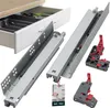 A kitchen drawer with a cutlery organizer and detached drawer slides and mounting brackets. Produktbild-Vorschau